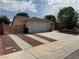 Attractive single story home with a two-car garage, wide driveway, and well maintained landscaping at 228 Hiawatha Way, Mesquite, NV 89027