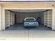 Garage features ample storage shelving and a classic car, perfect for car enthusiasts or hobbyists at 228 Hiawatha Way, Mesquite, NV 89027