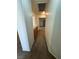Hallway with neutral paint, carpet, and access to rooms on either side at 228 Hiawatha Way, Mesquite, NV 89027
