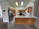 Eat-in kitchen boasts modern appliances, tile flooring, and ample counter space at 228 Hiawatha Way, Mesquite, NV 89027