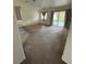 Open living room with carpet flooring and sliding glass doors to the backyard at 228 Hiawatha Way, Mesquite, NV 89027