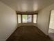 Bright living room with large windows and neutral carpeting at 228 Hiawatha Way, Mesquite, NV 89027