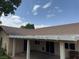 Rear view of home showcases the covered patio and beautifully landscaped backyard, creating a relaxing retreat at 228 Hiawatha Way, Mesquite, NV 89027