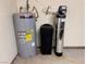 Utility area featuring a modern water heater and filtration system for efficient home maintenance at 228 Hiawatha Way, Mesquite, NV 89027