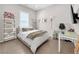 Bright bedroom features a full bed, accent lighting, and a streamlined desk space, perfect for studying or relaxing at 253 Robledo St, Las Vegas, NV 89138