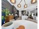 Open dining area showcases modern decor, stylish light fixture, and seamless connection to the kitchen at 253 Robledo St, Las Vegas, NV 89138