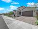 Attractive single-story house showcasing a manicured front yard and brick-paved driveway and walkway at 253 Robledo St, Las Vegas, NV 89138