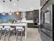 Contemporary kitchen with a marble island, stainless steel appliances, and counter seating at 253 Robledo St, Las Vegas, NV 89138