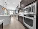 Bright, modern kitchen with stainless steel appliances, marble countertops, and an adjacent dining area at 253 Robledo St, Las Vegas, NV 89138