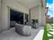 Covered outdoor patio with comfortable seating and an indoor/outdoor fireplace at 253 Robledo St, Las Vegas, NV 89138