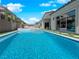 A sparkling pool and spa provide a luxurious backyard oasis with clear blue water at 253 Robledo St, Las Vegas, NV 89138
