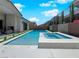 Resort-style pool and spa surrounded by lush greenery and ample patio space at 253 Robledo St, Las Vegas, NV 89138