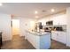 Bright kitchen featuring white cabinets, stainless appliances, and kitchen island at 2678 Weathered Copper Ave, North Las Vegas, NV 89086