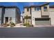 Charming two-story townhome with a two-car garage, beautiful landscaping, and stylish architectural details at 2678 Weathered Copper Ave, North Las Vegas, NV 89086