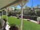 Professionally landscaped backyard with synthetic grass and privacy landscaping at 2747 Sandalwood Ave, Henderson, NV 89074