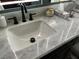 Close-up of a modern bathroom sink with marble countertop and matte black faucet at 2747 Sandalwood Ave, Henderson, NV 89074