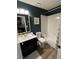 Traditional bathroom featuring a tub and shower combo, single sink vanity, and commode at 2747 Sandalwood Ave, Henderson, NV 89074
