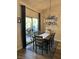 Cozy dining room with wooden table and a sliding glass door leading to the outside at 2747 Sandalwood Ave, Henderson, NV 89074