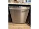 Stainless steel dishwasher set within dark cabinetry and light countertop at 2747 Sandalwood Ave, Henderson, NV 89074
