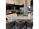 Modern kitchen with a large, light granite island and stainless steel appliances at 2747 Sandalwood Ave, Henderson, NV 89074