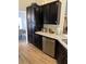 Close up of kitchen cabinets and counter with stainless steel dishwasher at 2747 Sandalwood Ave, Henderson, NV 89074