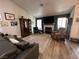 Large living room with hardwood floors, fireplace, and large windows at 2747 Sandalwood Ave, Henderson, NV 89074