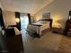 Spacious main bedroom features a plush rug, comfy bed and backyard access via sliding glass doors at 2747 Sandalwood Ave, Henderson, NV 89074