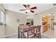 Bright breakfast nook features a wood table set, a ceiling fan, and an open view to the kitchen at 2831 Geary Pl # 2918, Las Vegas, NV 89109