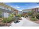 View of a landscaped common area with a grill and paved walkway between buildings at 2831 Geary Pl # 2918, Las Vegas, NV 89109