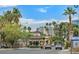 View of the Las Vegas Country Club Estates entrance and guard house on a sunny day at 2831 Geary Pl # 2918, Las Vegas, NV 89109