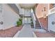 View of the building entrance with exterior staircase and landscape at 2831 Geary Pl # 2918, Las Vegas, NV 89109