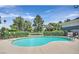Refreshing community pool with lounge chairs and view of the golf course on a sunny day at 2831 Geary Pl # 2918, Las Vegas, NV 89109