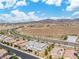 This aerial view displays an organized neighborhood in a beautiful desert community with mountain views at 2832 Aragon Terrace Way, Henderson, NV 89044