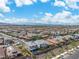 A sprawling community with uniform rooftops, and mountain views under a sunny sky in a desert landscape at 2832 Aragon Terrace Way, Henderson, NV 89044
