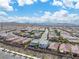 The aerial view showcases a well-organized neighborhood, complete with a scenic backdrop of rolling desert hills at 2832 Aragon Terrace Way, Henderson, NV 89044