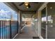 Covered back patio with outdoor grill and view of the refreshing community pool at 2832 Aragon Terrace Way, Henderson, NV 89044
