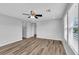 Spacious bedroom with fan, laminate floors, and natural light at 2832 Aragon Terrace Way, Henderson, NV 89044