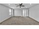 Spacious bonus room features neutral walls, carpet, and ceiling fan at 2832 Aragon Terrace Way, Henderson, NV 89044