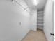 Walk-in closet with shelving and tiled floors at 2832 Aragon Terrace Way, Henderson, NV 89044