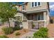 Close-up of a home's exterior showcasing stone accents, shutters, and a brick walkway at 2832 Aragon Terrace Way, Henderson, NV 89044