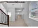 Bright foyer with tile flooring, staircase, and natural light from the front window at 2832 Aragon Terrace Way, Henderson, NV 89044