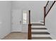 Bright foyer features tile floors, a wooden staircase, and neutral walls at 2832 Aragon Terrace Way, Henderson, NV 89044