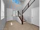 Bright foyer with tile flooring, staircase, and natural light at 2832 Aragon Terrace Way, Henderson, NV 89044