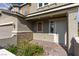 Exterior view featuring stone accents, a brick walkway, and a white security screen door at 2832 Aragon Terrace Way, Henderson, NV 89044