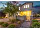 Inviting front exterior featuring a well-kept yard, stone accents, and a charming gated entry at 2832 Aragon Terrace Way, Henderson, NV 89044