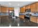 A modern kitchen boasts granite counters, stainless appliances, and ample cabinet space, perfect for cooking and entertaining at 2832 Aragon Terrace Way, Henderson, NV 89044