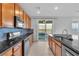Well-equipped kitchen featuring a gas range, stainless appliances and granite countertops at 2832 Aragon Terrace Way, Henderson, NV 89044