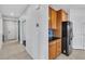 Convenient kitchenette with stainless steel refrigerator and granite countertops at 2832 Aragon Terrace Way, Henderson, NV 89044