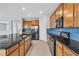 Modern kitchen with stainless steel appliances, granite countertops, and an open design at 2832 Aragon Terrace Way, Henderson, NV 89044