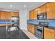 Well-equipped kitchen features stainless steel appliances and granite countertops at 2832 Aragon Terrace Way, Henderson, NV 89044